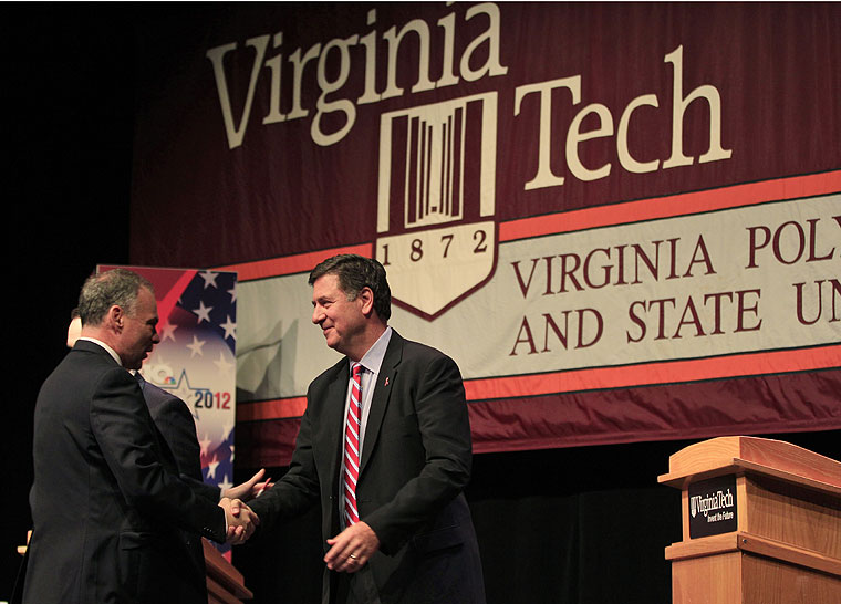 Former Gov. Timothy M. Kaine, left, and former Sen. George Allen, right, shake hands prior to a debate at Virginia Tech in Blacksburg on Thursday, Oct. 18, 2012. (Steve Helber | The Associated Press)