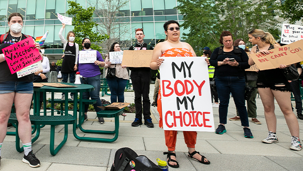 Students with quotes on the papers in-front of Johnson Center, Fairfax Campus