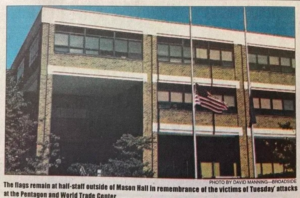 Archival photo showing the American flag at half-staff on Mason's Fairfax campus on September 11, 2001.