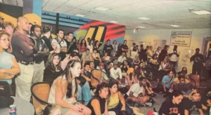 Archival photo showing Mason students watching coverage of 9/11 attacks.